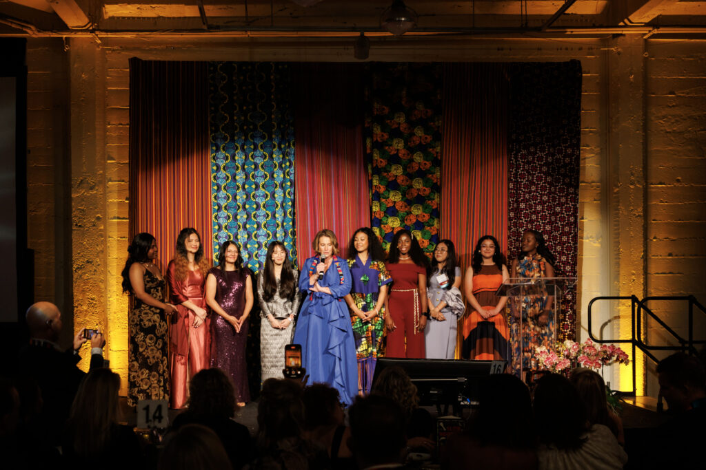 The scholars gathered onstage with CEO, Annelise Bauer, after delivering their compelling stories.